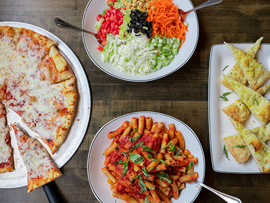 birds eye view of pasta marinara family meal