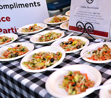 table of plates containing salads