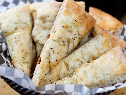 a basket of rosemary bread