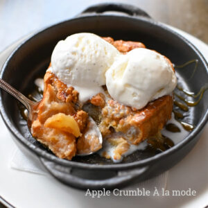 two scoops of vanilla ice cream with apple crumble