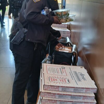 A first responder serving herself some Maria's at the CD11 District Office